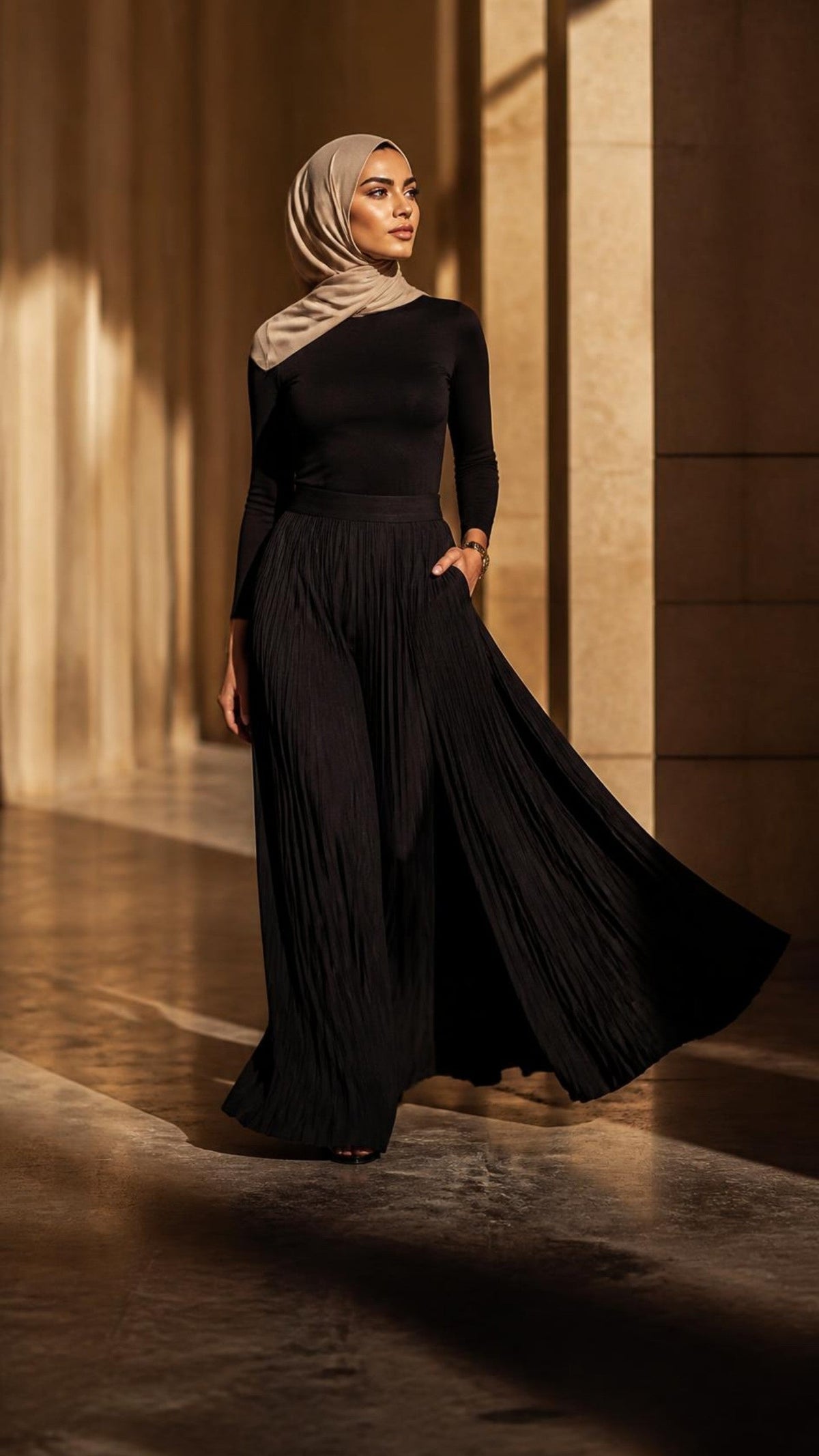 Woman in a hijab wearing black pleated wide-leg pants