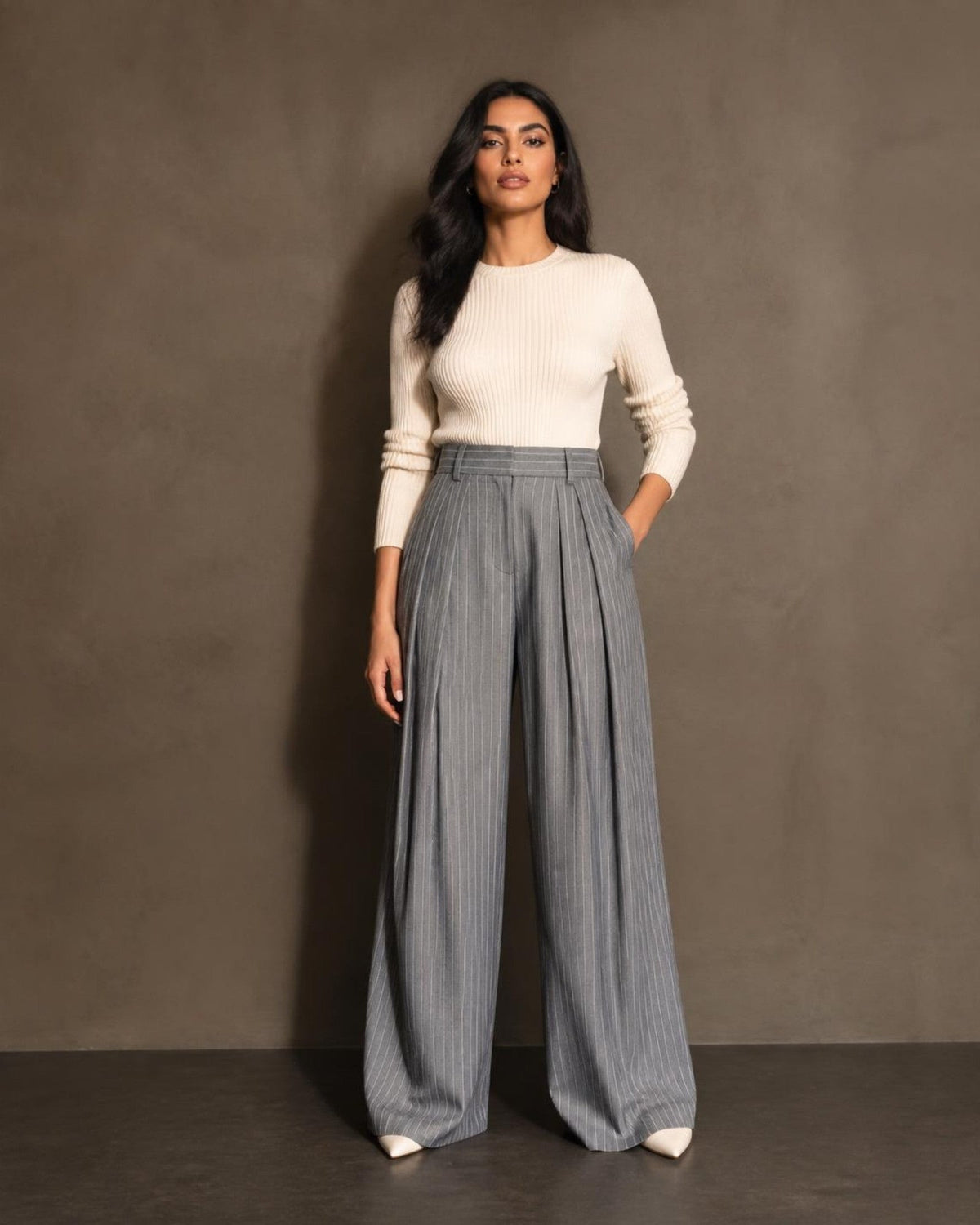 Woman wearing grey pinstripe tailored wide-leg pants
